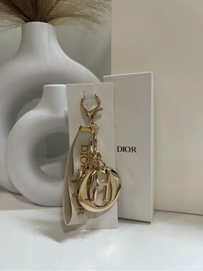 Dior Gold-Tone Letter Charm Keyring with Ivory Ribbon unbranded